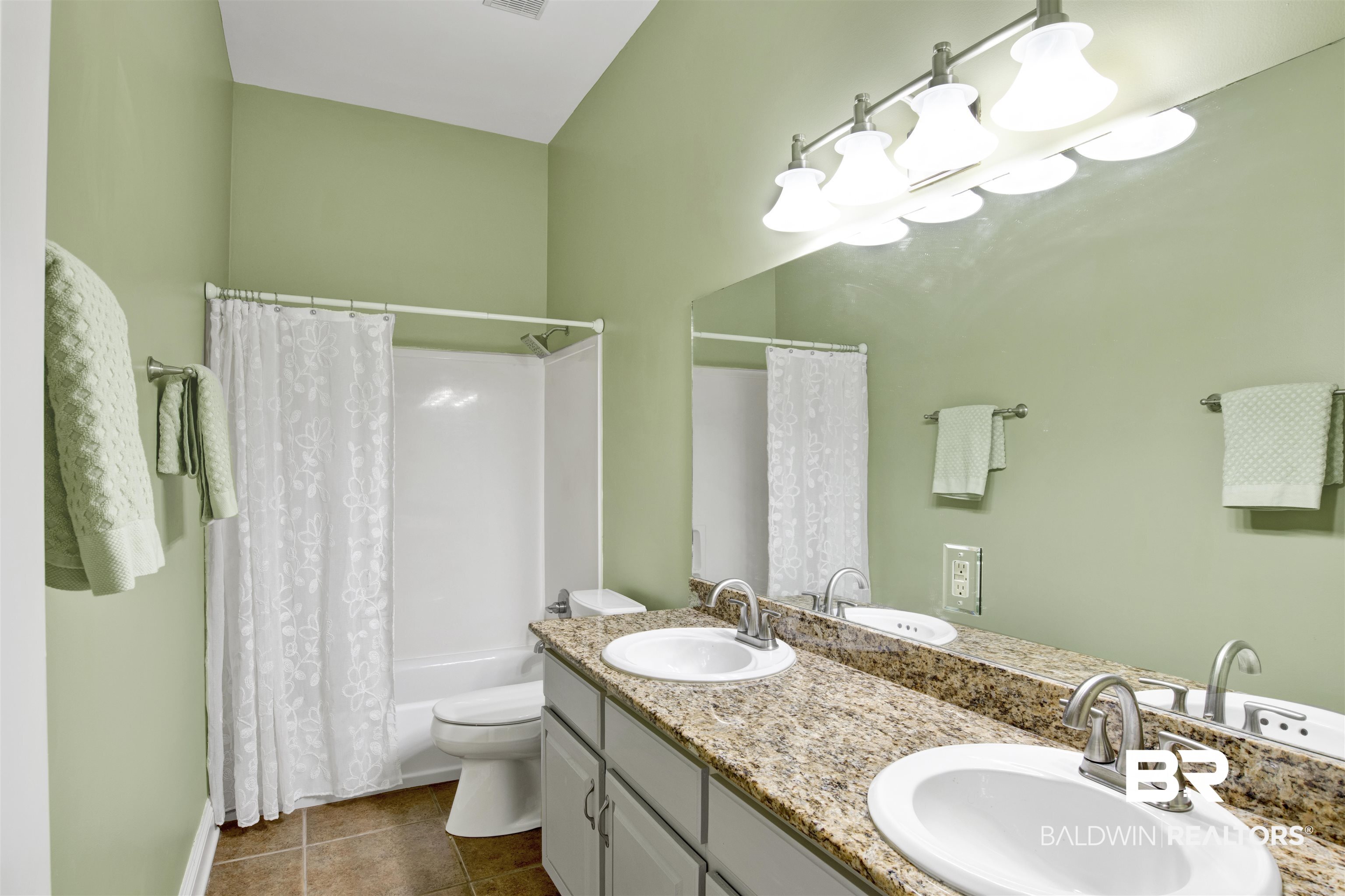 4340 Hamilton Oaks Lane Mobile, AL 36695 - Photo 24 of 51 Full bathroom with oversized vanity, double sink, shower / tub combo, tile floors, and toilet
