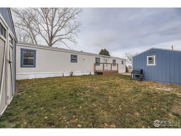 a backyard of a house with wooden fence