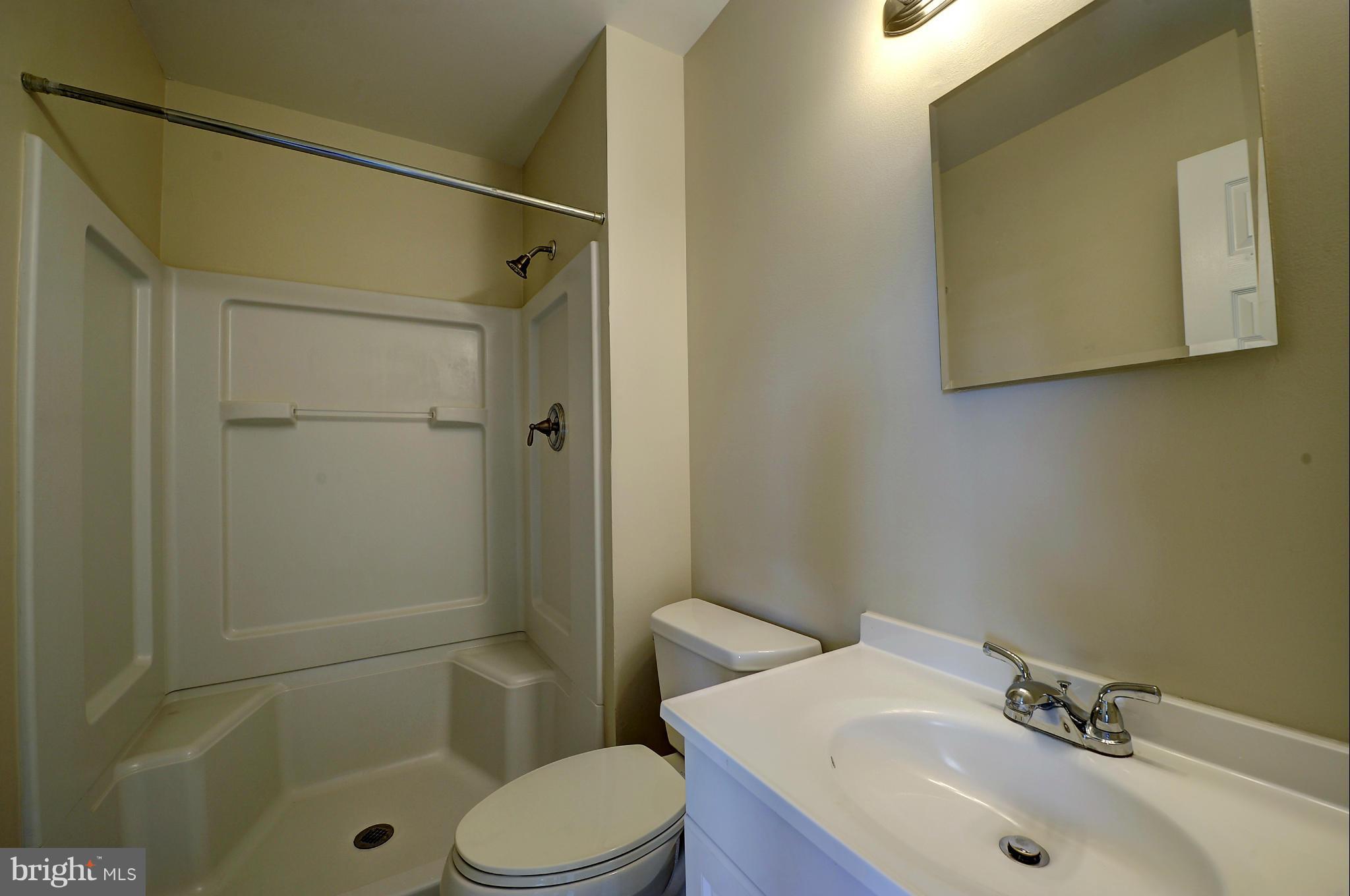 4320 Cub Run Road Chantilly, VA 20151 - Photo 22 of 30 a bathroom with a sink toilet and shower