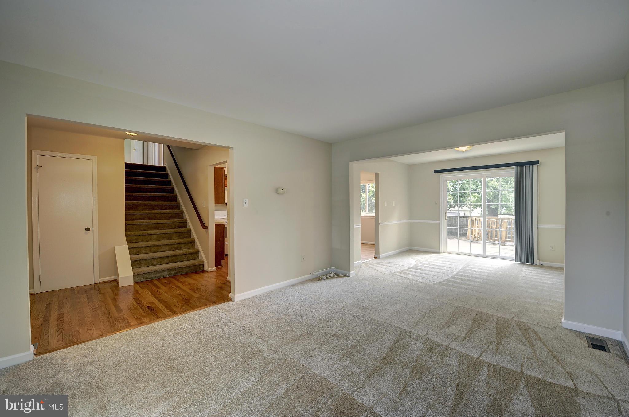 4320 Cub Run Road Chantilly, VA 20151 - Photo 5 of 30 a view of an empty room with wooden floor and stairs