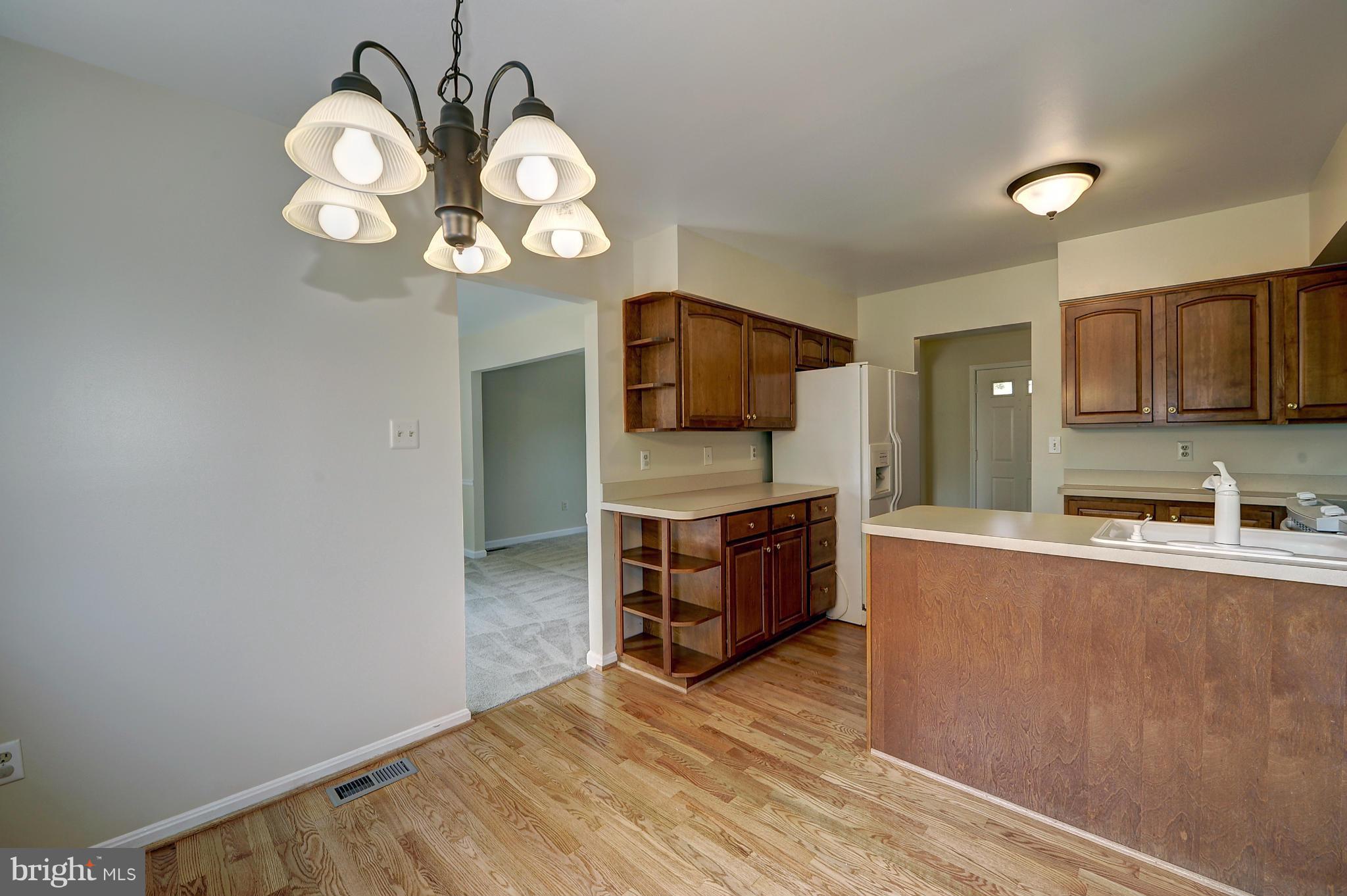 4320 Cub Run Road Chantilly, VA 20151 - Photo 10 of 30 a kitchen with a refrigerator and a stove top oven