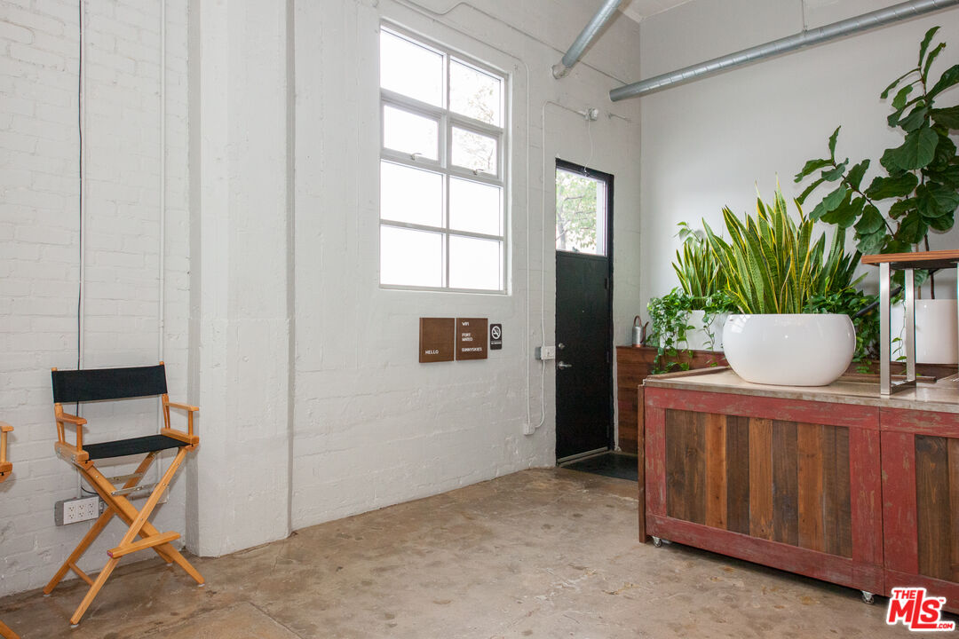 530 Molino Street, Unit 113 Los Angeles, CA 90013 - Photo 13 of 16 a view of room with a potted plant on a counter and a window