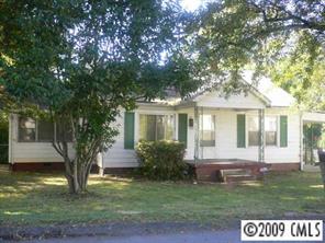 96 Robbins Street Southwest Concord, NC 28025 - Photo 1 of 3 a front view of a house with garden