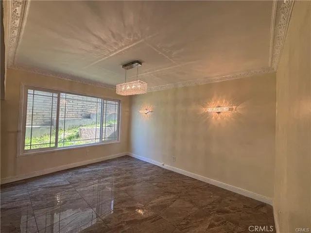 an empty room with a empty space and a window