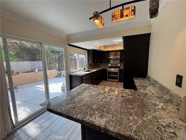 a view of kitchen with cabinets