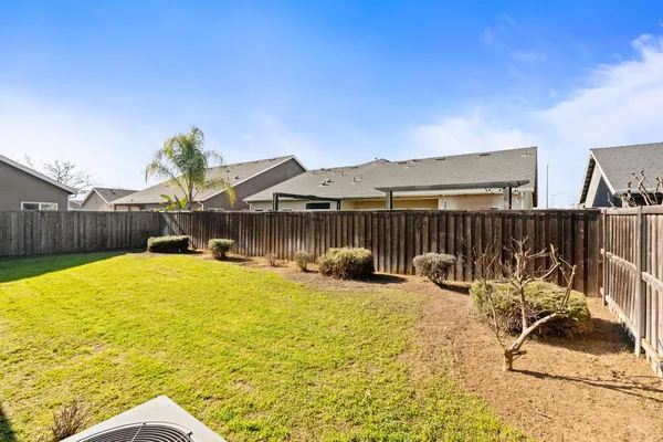a view of a house with swimming pool and furniture