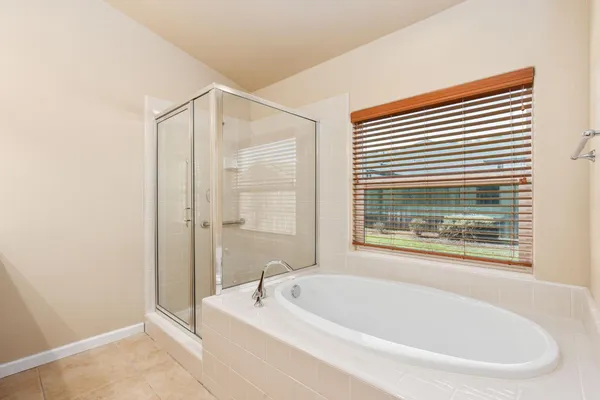 a white bath tub sitting next to a window