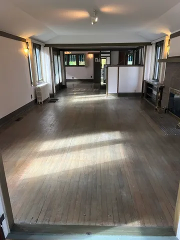 a view of lobby with stairs and a floor to ceiling window