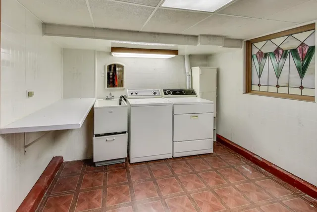 a view of a house with pool and sitting area