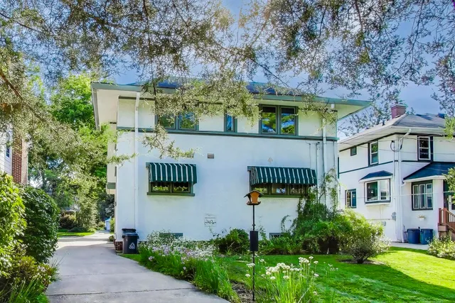 a picture of a bench in front of a wall