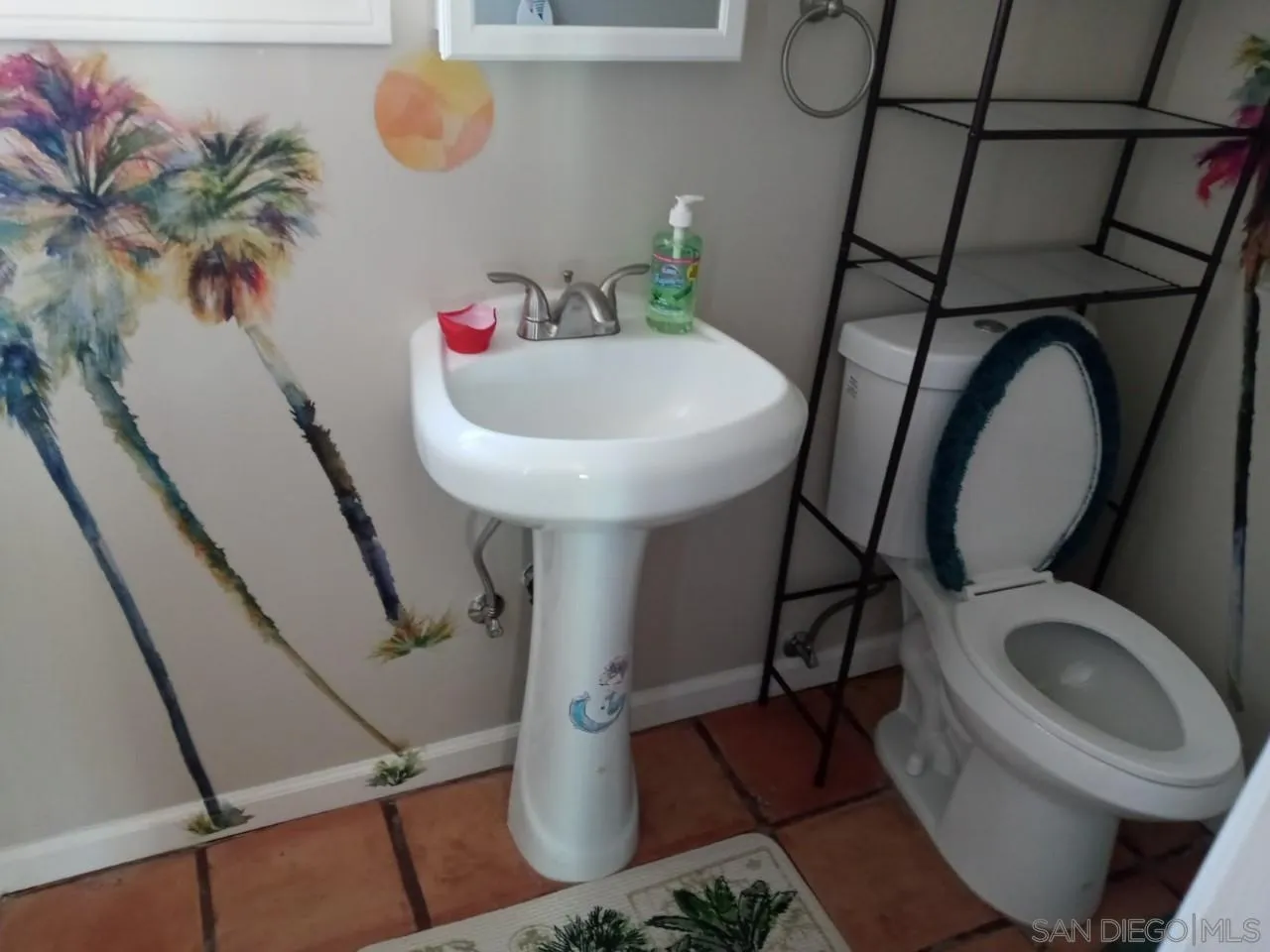 14380 Rios Canyon Road El Cajon, CA 92021 - Photo 13 of 14 a bathroom with a toilet mirror and vanity