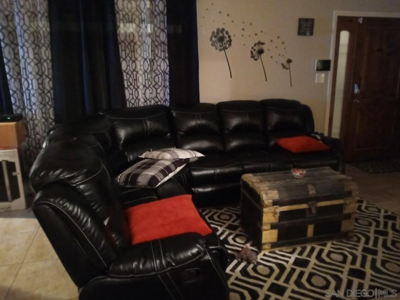 14380 Rios Canyon Road El Cajon, CA 92021 - Photo 2 of 14 a black and white wall with a potted plant on a table