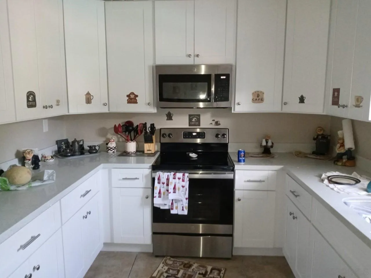 14380 Rios Canyon Road El Cajon, CA 92021 - Photo 3 of 14 a kitchen with stainless steel appliances granite countertop a sink a stove and cabinets