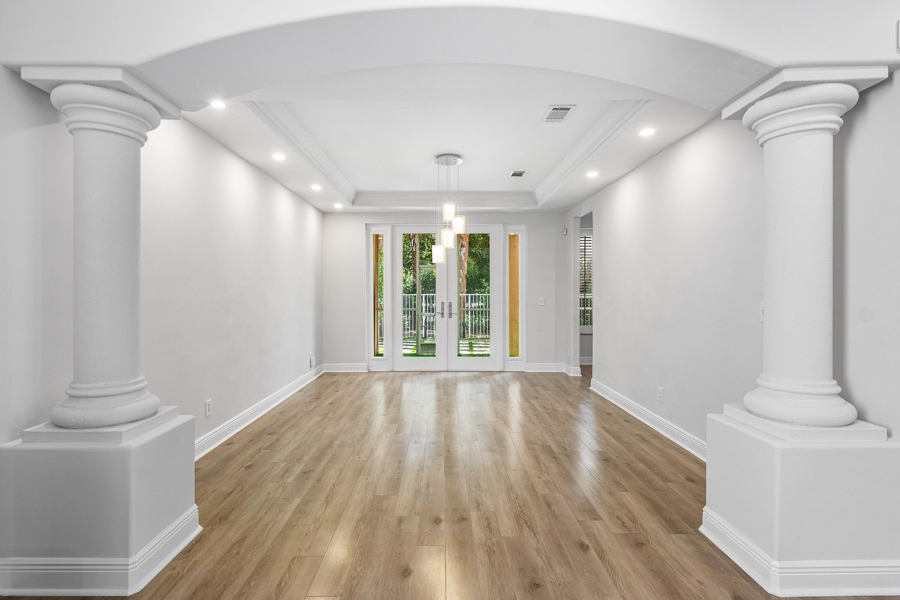 1655 East Classical Boulevard Delray Beach, FL 33445 - Photo 12 of 40 a view of an empty room with wooden floor and a window