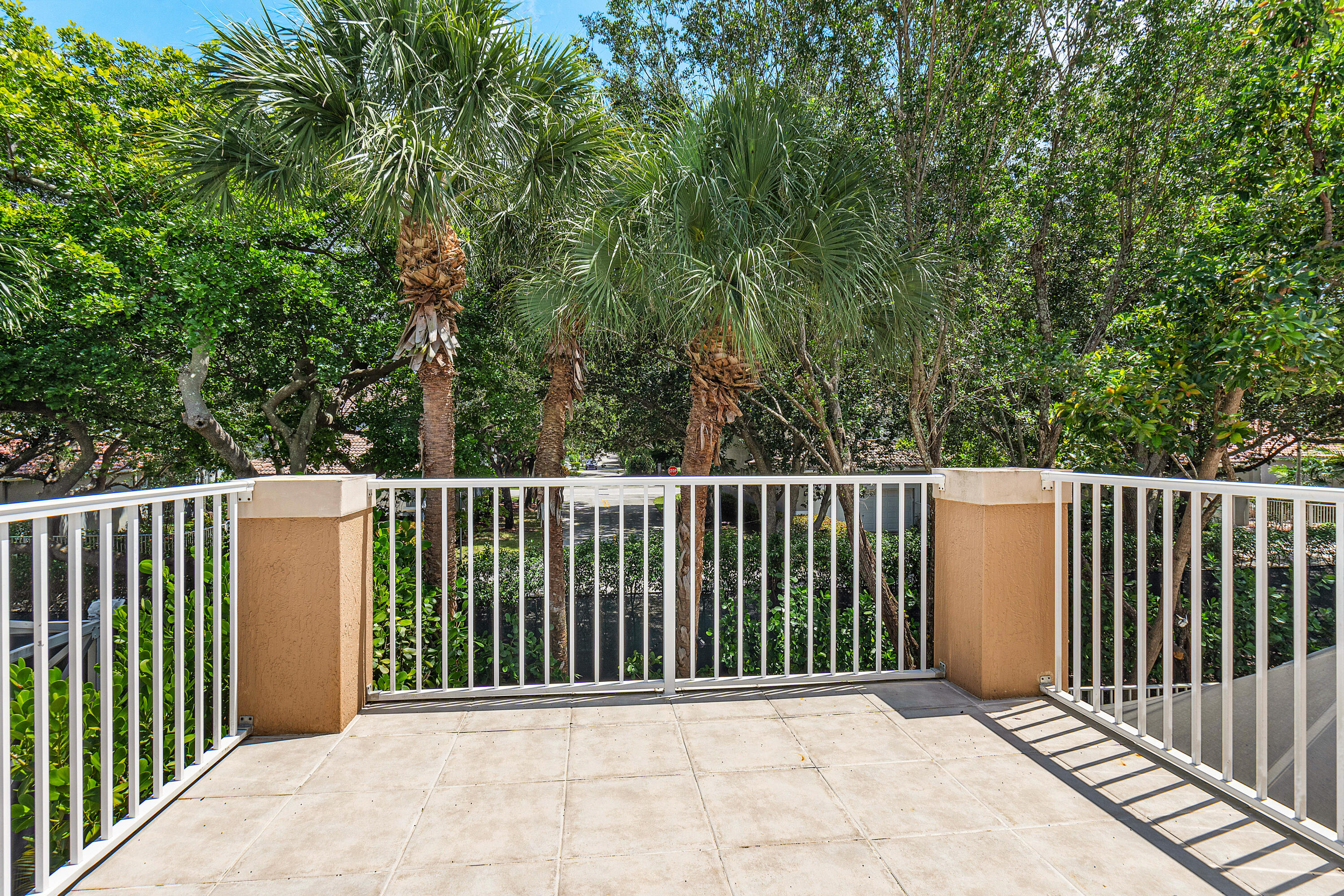 1655 East Classical Boulevard Delray Beach, FL 33445 - Photo 17 of 40 a balcony with trees in front of it