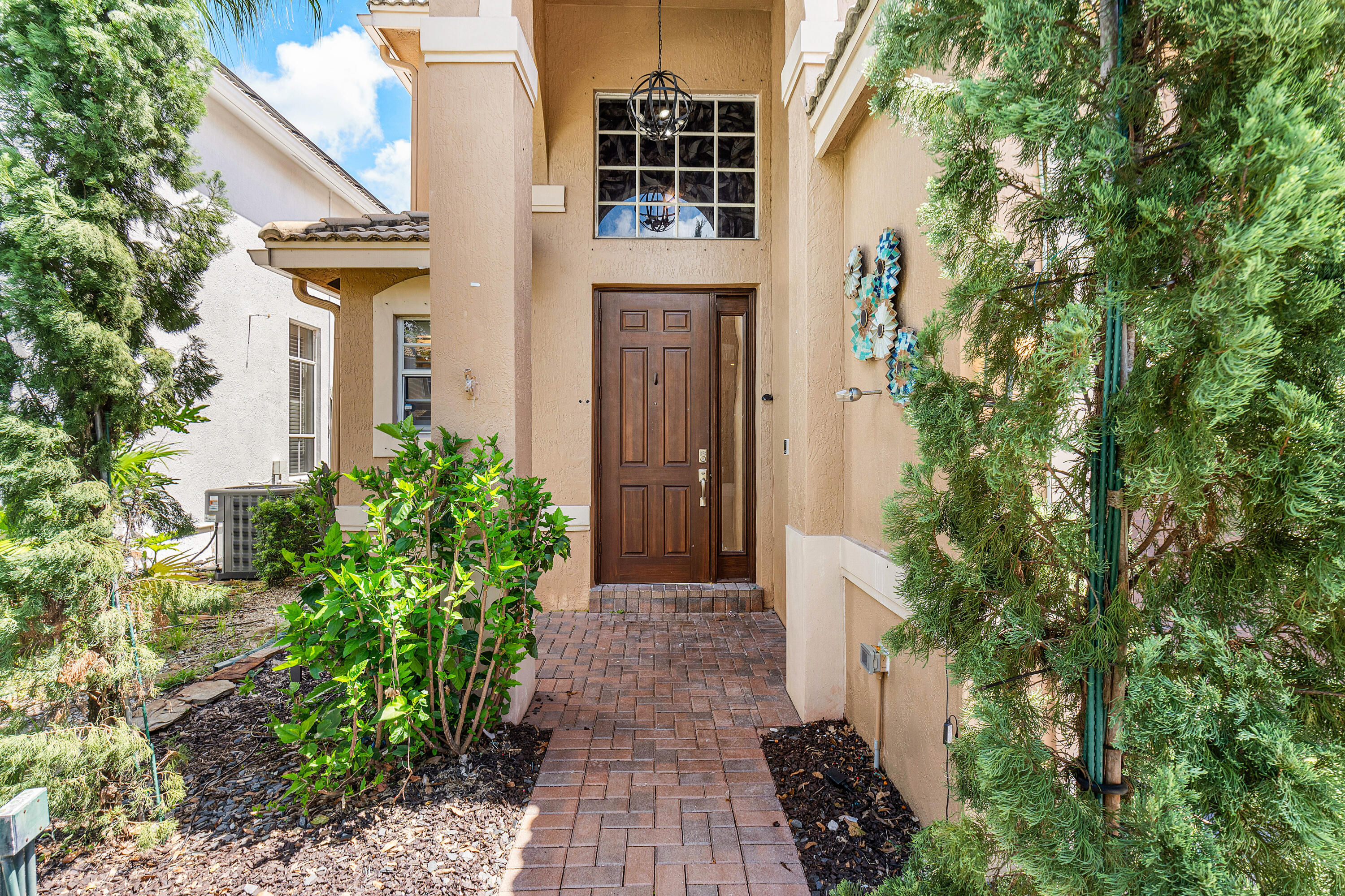 1655 East Classical Boulevard Delray Beach, FL 33445 - Photo 34 of 40 a front view of a house with a yard