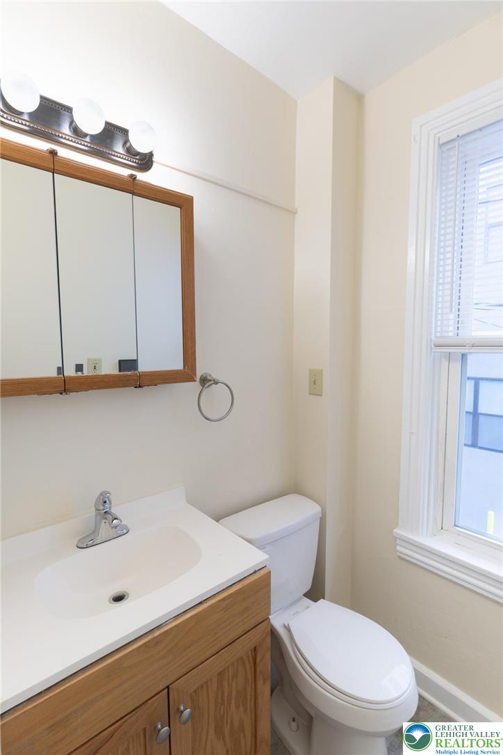 32 West Raspberry Street Bethlehem, PA 18018 - Photo 14 of 17 a bathroom with a sink a mirror and a toilet