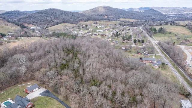 an aerial view of residential houses and outdoor space
