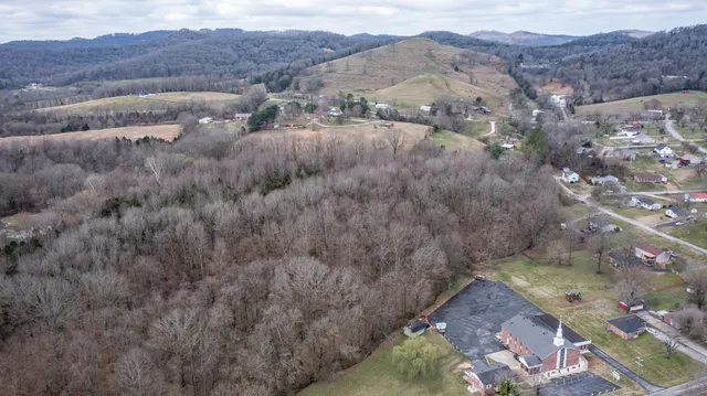an aerial view of residential houses and outdoor space