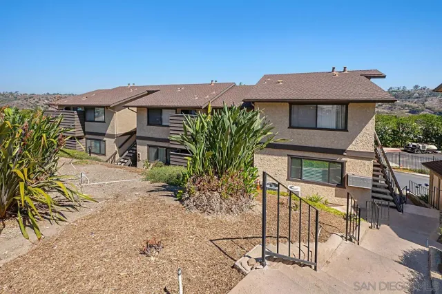 a view of a house with a street