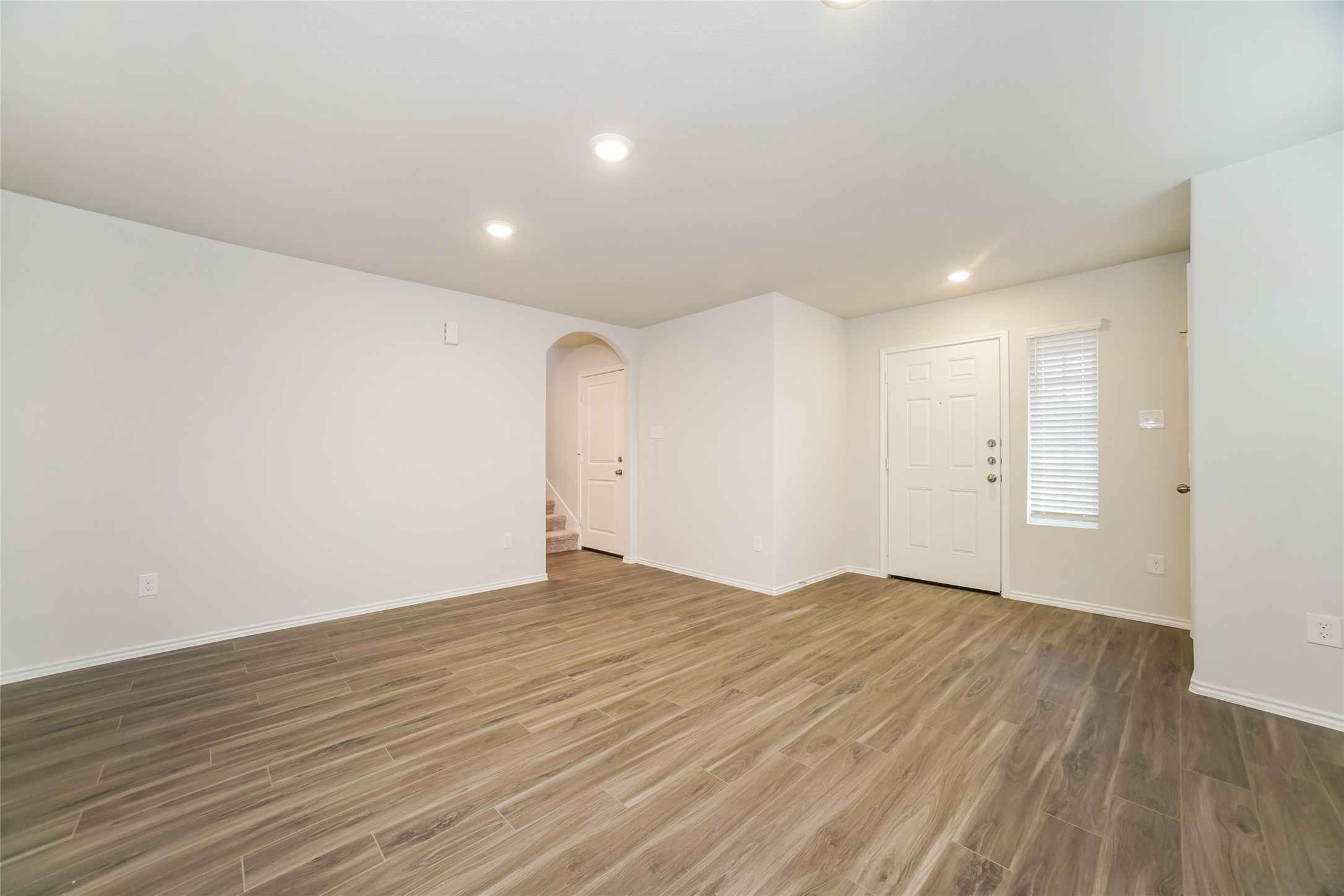 2161 Middle Rdg Drive Conroe, TX 77301 - Photo 8 of 20 a view of an empty room with wooden floor