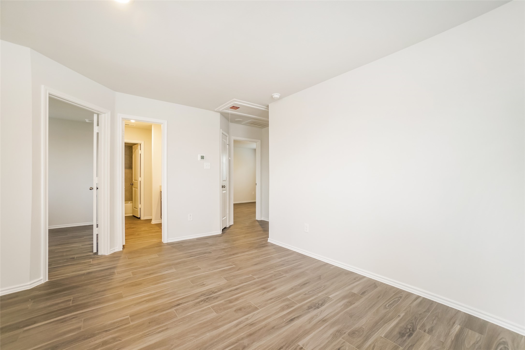 2161 Middle Rdg Drive Conroe, TX 77301 - Photo 9 of 20 a view of an empty room with wooden floor