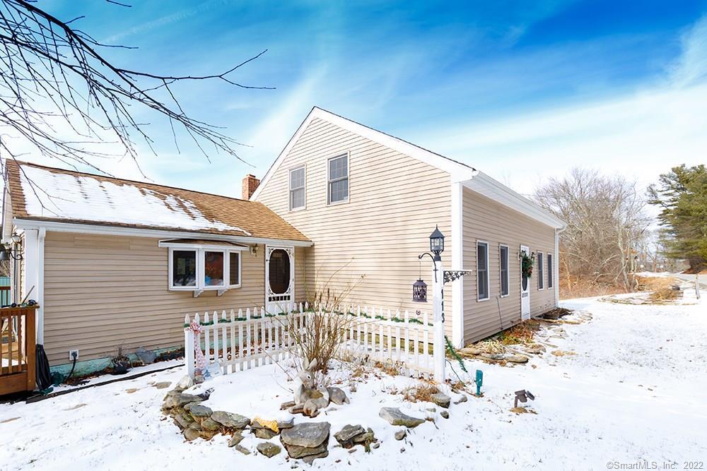 113 Geer Road Killingly, CT 06239 - Photo 1 of 1 a front view of a house with a yard covered in snow