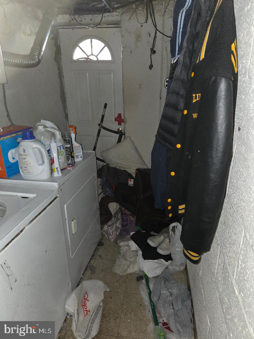 6340 Calvert Street Philadelphia, PA 19149 - Photo 14 of 14 a bathroom with a sink and mirror with toilet