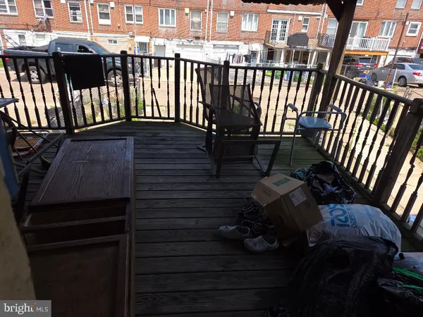 a view of balcony with wooden floor