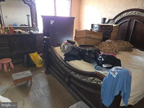 a living room with furniture and a lamp