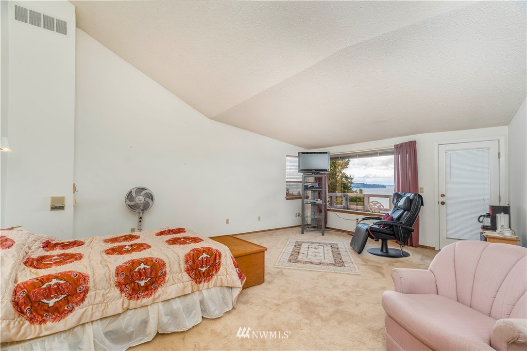2604 Madrona Point Lane Steilacoom, WA 98388 - Photo 14 of 25 a bedroom with a bed and window