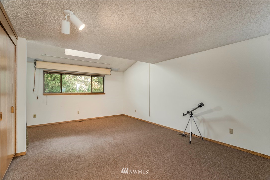 2604 Madrona Point Lane Steilacoom, WA 98388 - Photo 19 of 25 a view of an empty room with a window