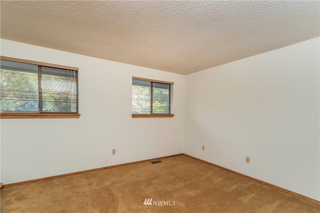 2604 Madrona Point Lane Steilacoom, WA 98388 - Photo 20 of 25 an empty room with a window