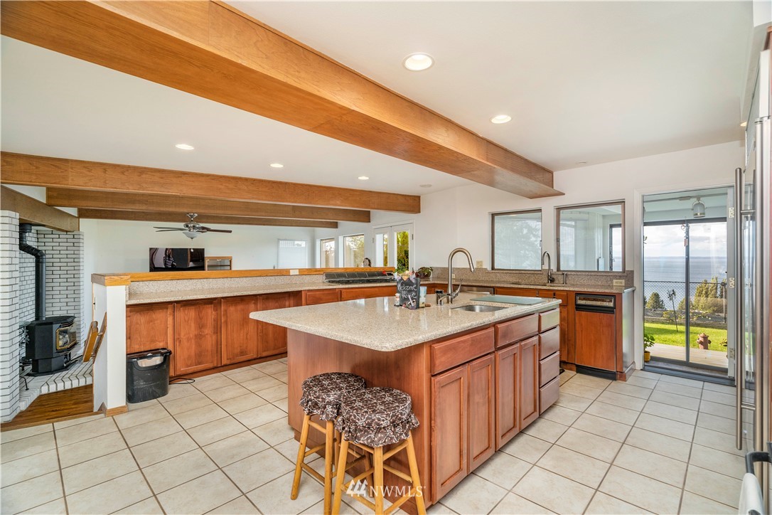 2604 Madrona Point Lane Steilacoom, WA 98388 - Photo 6 of 25 a kitchen with a sink and cabinets