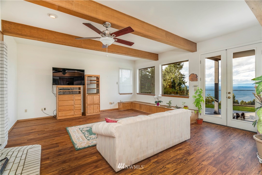 2604 Madrona Point Lane Steilacoom, WA 98388 - Photo 7 of 25 a living room with furniture and a large window