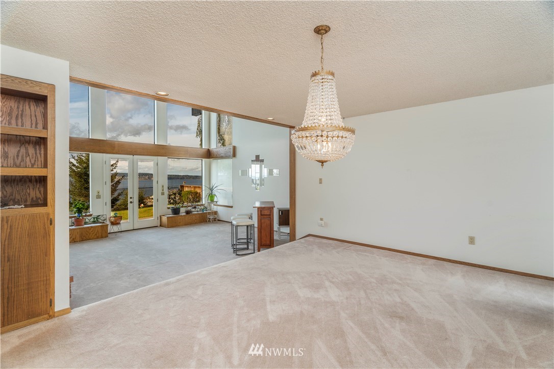 2604 Madrona Point Lane Steilacoom, WA 98388 - Photo 9 of 25 a view of a room with cabinet mirror and windows