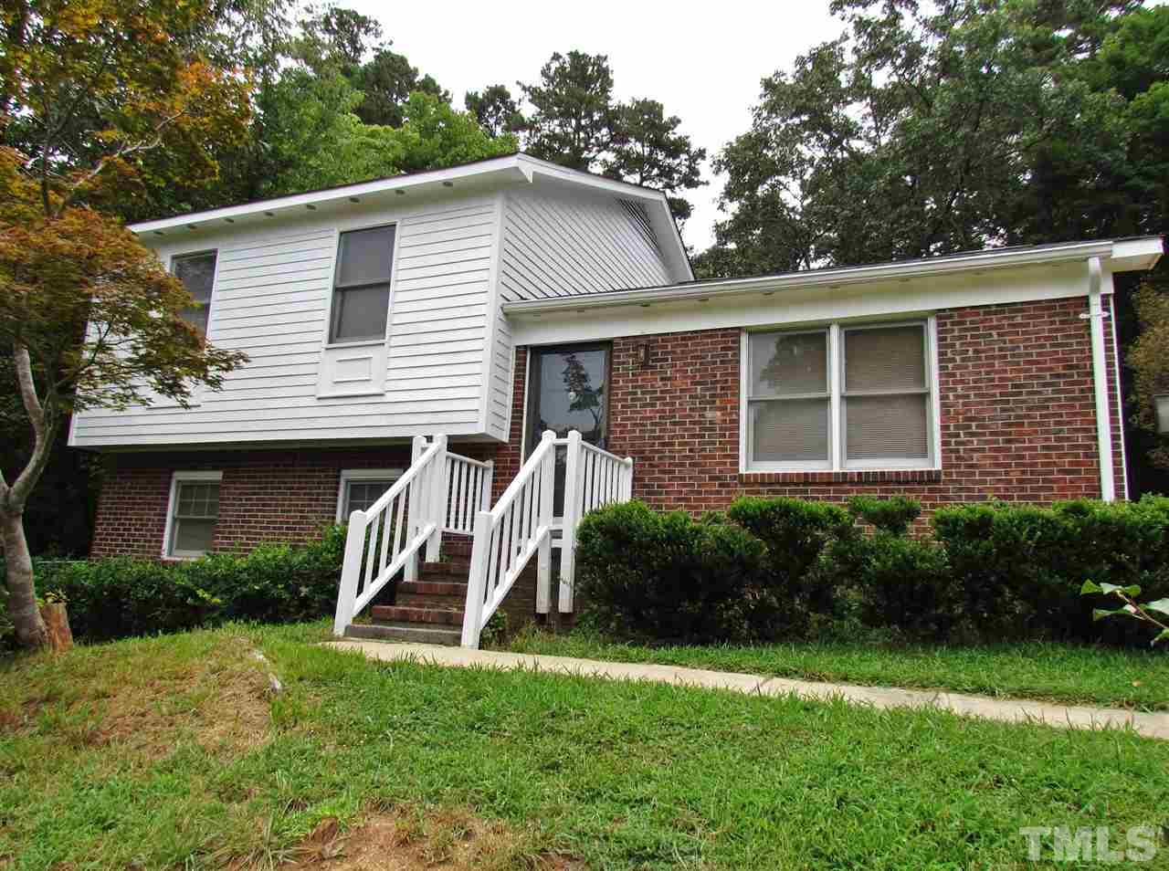 7813 Nugget Lane Raleigh, NC 27615 - Photo 1 of 25 a view of a house with a yard and plants