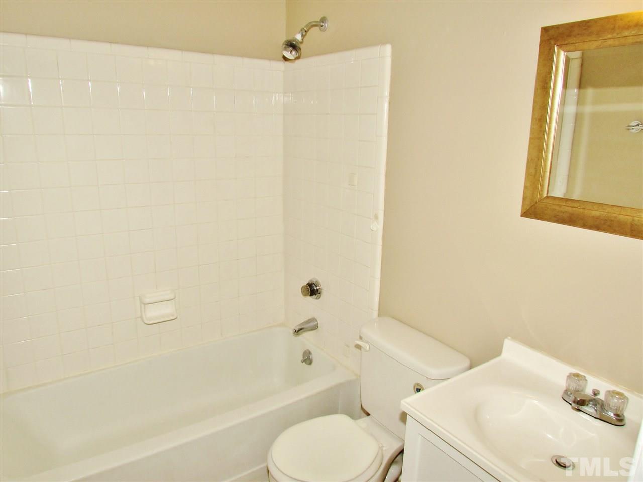 7813 Nugget Lane Raleigh, NC 27615 - Photo 12 of 25 a bathroom with a sink toilet and shower