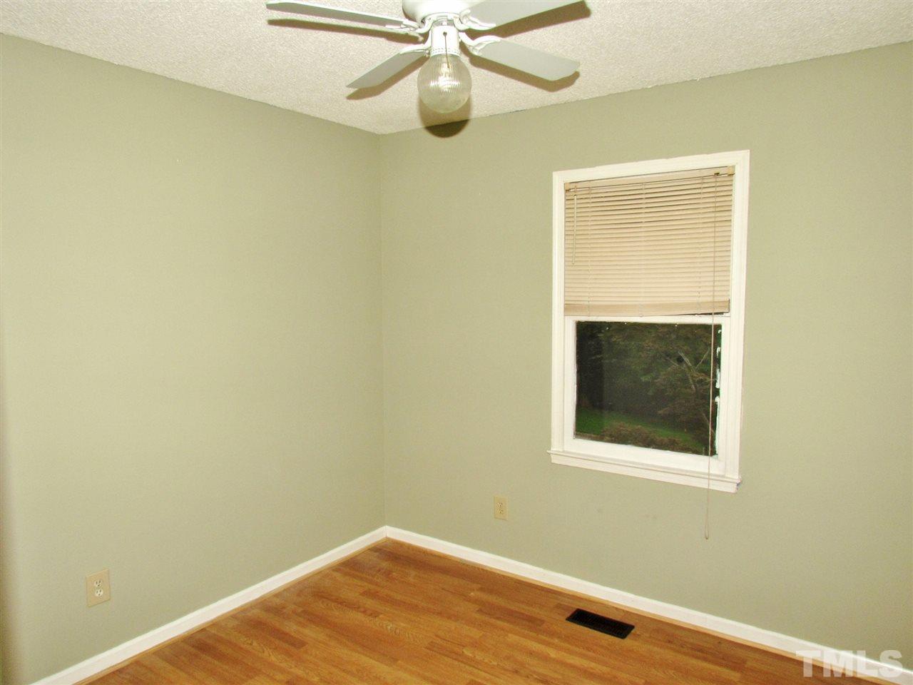 7813 Nugget Lane Raleigh, NC 27615 - Photo 13 of 25 a view of a small space with wooden floor and a window