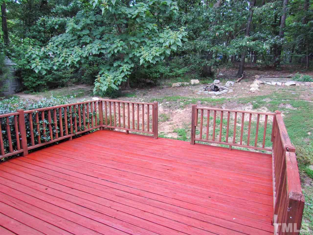 7813 Nugget Lane Raleigh, NC 27615 - Photo 20 of 25 a view of deck with wooden floor and fence