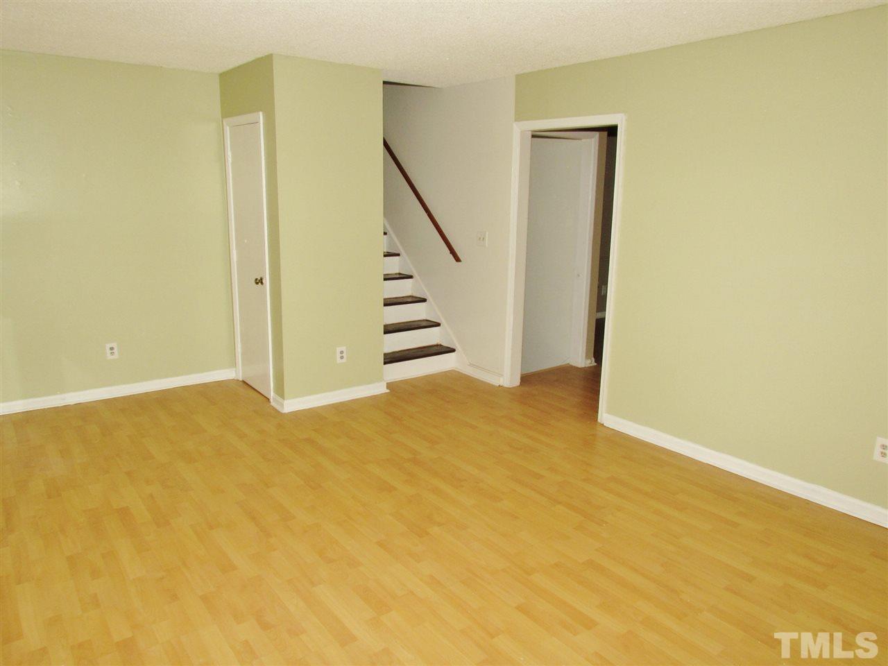 7813 Nugget Lane Raleigh, NC 27615 - Photo 3 of 25 a view of an empty room with stairs