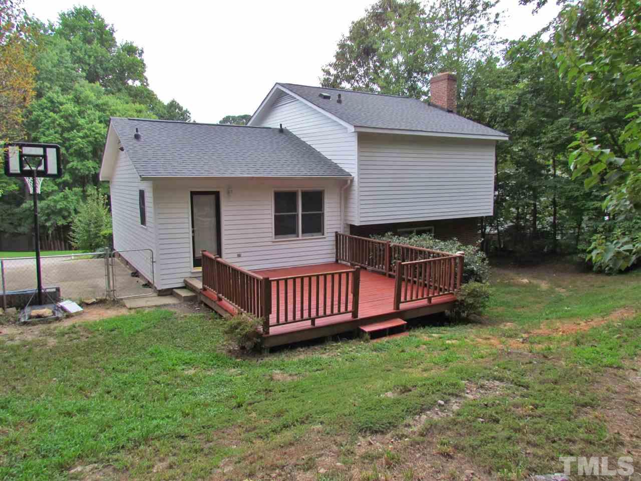7813 Nugget Lane Raleigh, NC 27615 - Photo 22 of 25 a front view of a house with garden