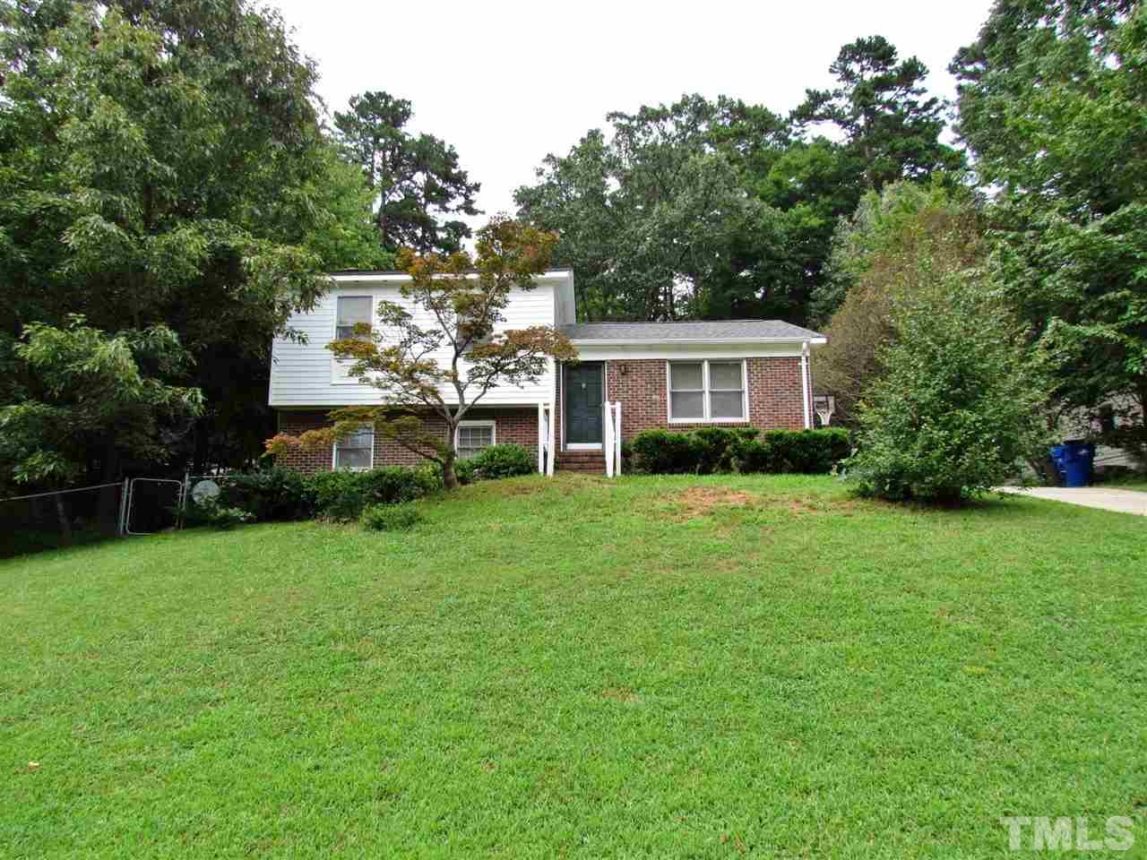 7813 Nugget Lane Raleigh, NC 27615 - Photo 24 of 25 a front view of a house with garden