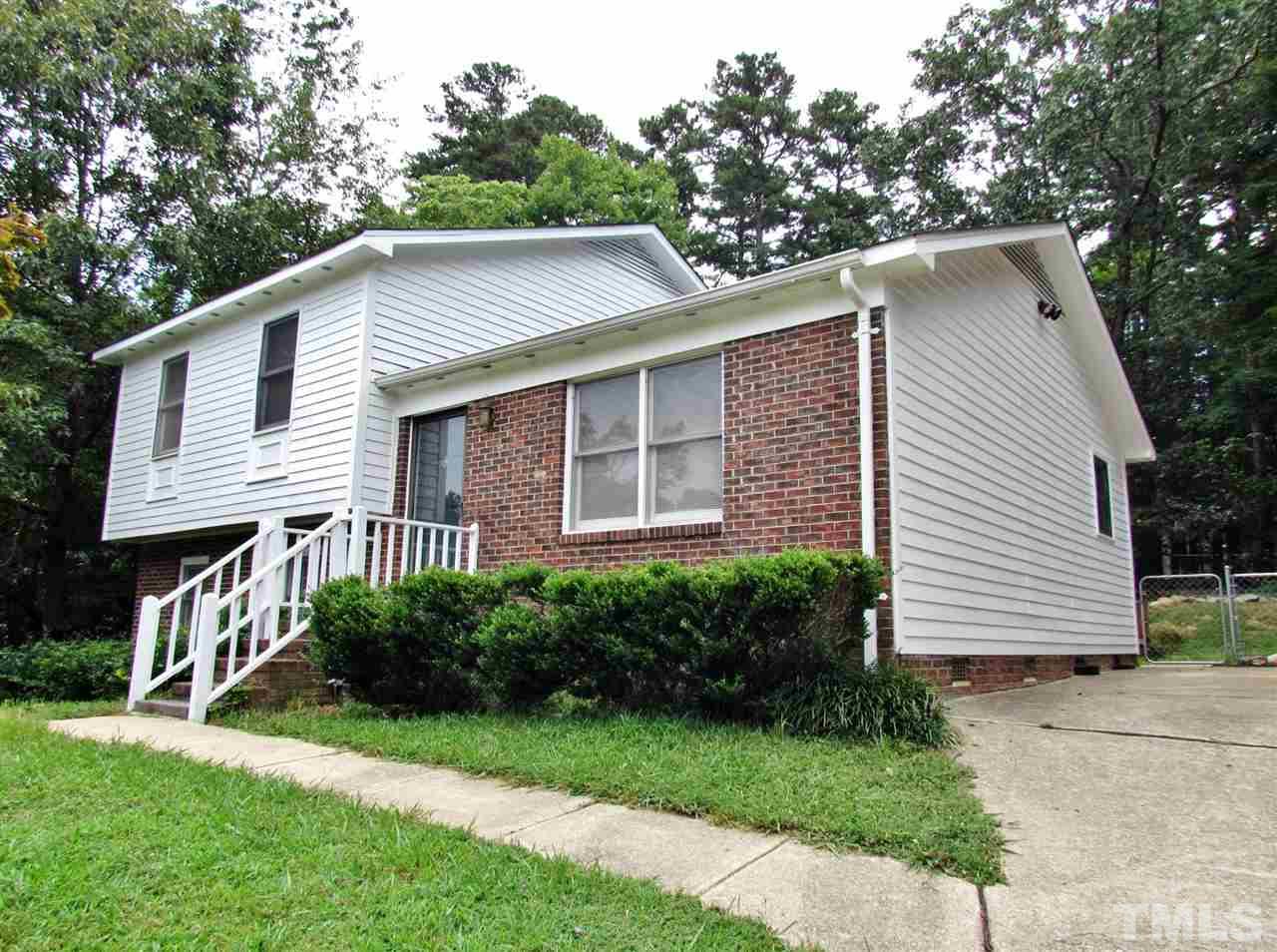 7813 Nugget Lane Raleigh, NC 27615 - Photo 25 of 25 a front view of a house with a yard