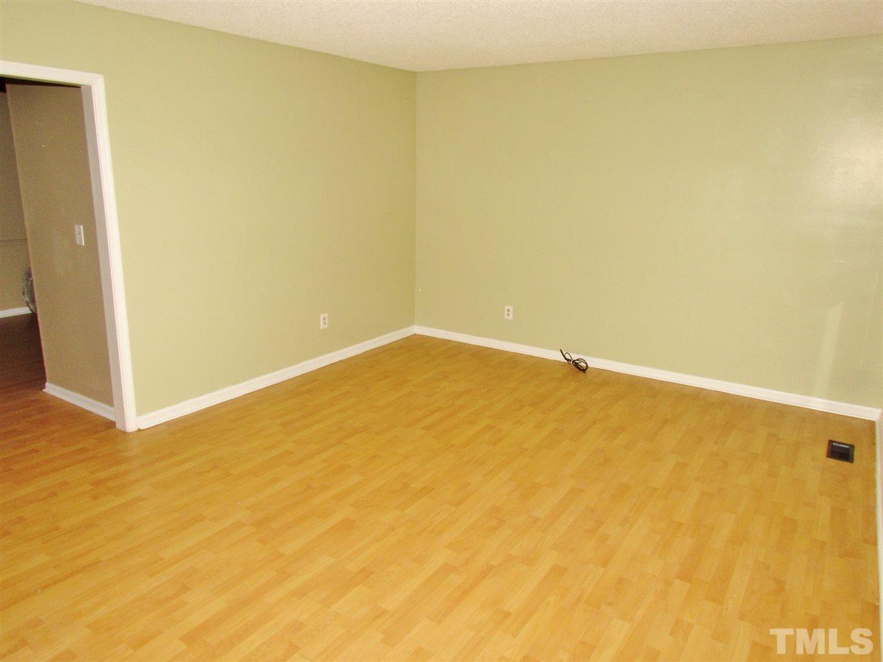 7813 Nugget Lane Raleigh, NC 27615 - Photo 4 of 25 a view of a big room with windows