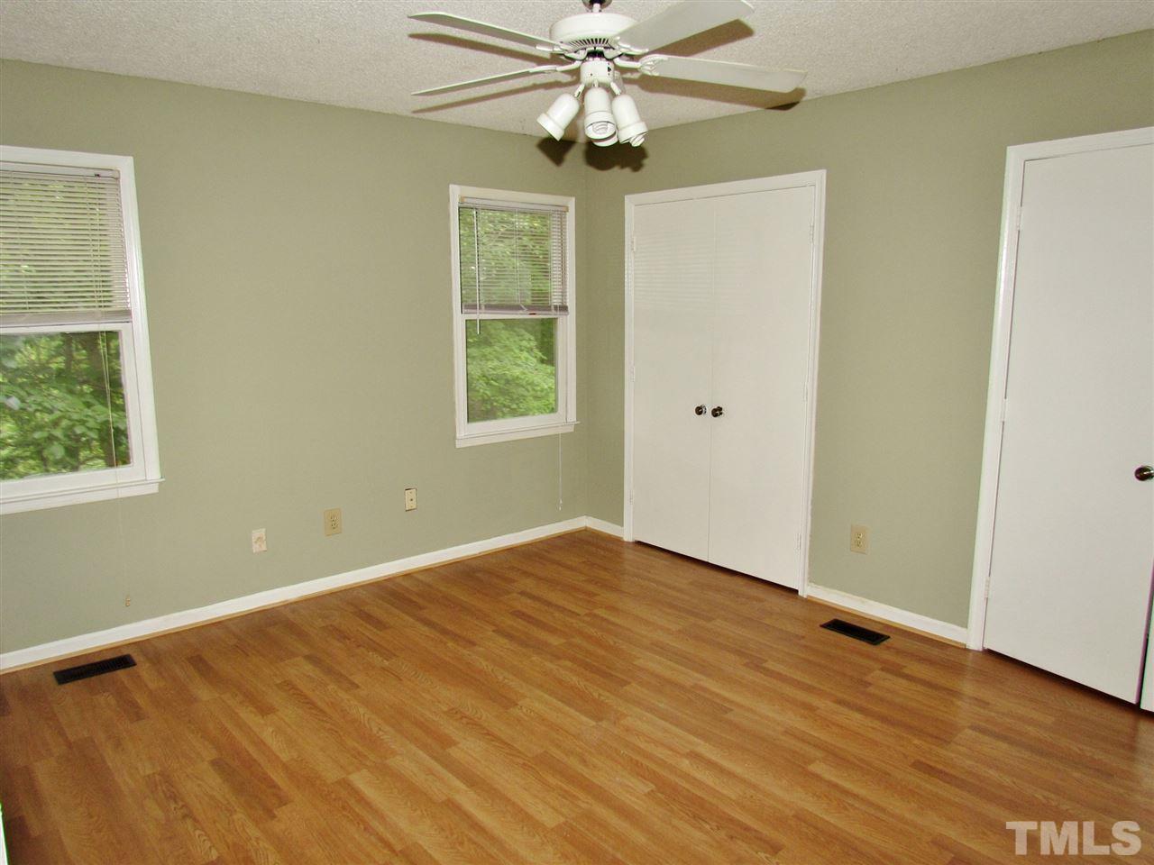 7813 Nugget Lane Raleigh, NC 27615 - Photo 7 of 25 wooden floor in an empty room with a window