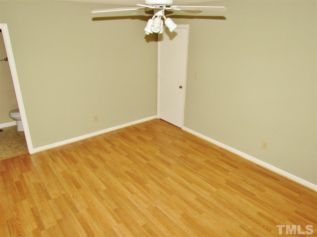 7813 Nugget Lane Raleigh, NC 27615 - Photo 8 of 25 a view of a room with wooden floor