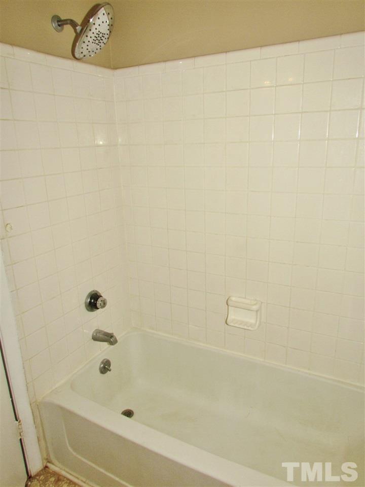 7813 Nugget Lane Raleigh, NC 27615 - Photo 9 of 25 a bathroom with a bathtub