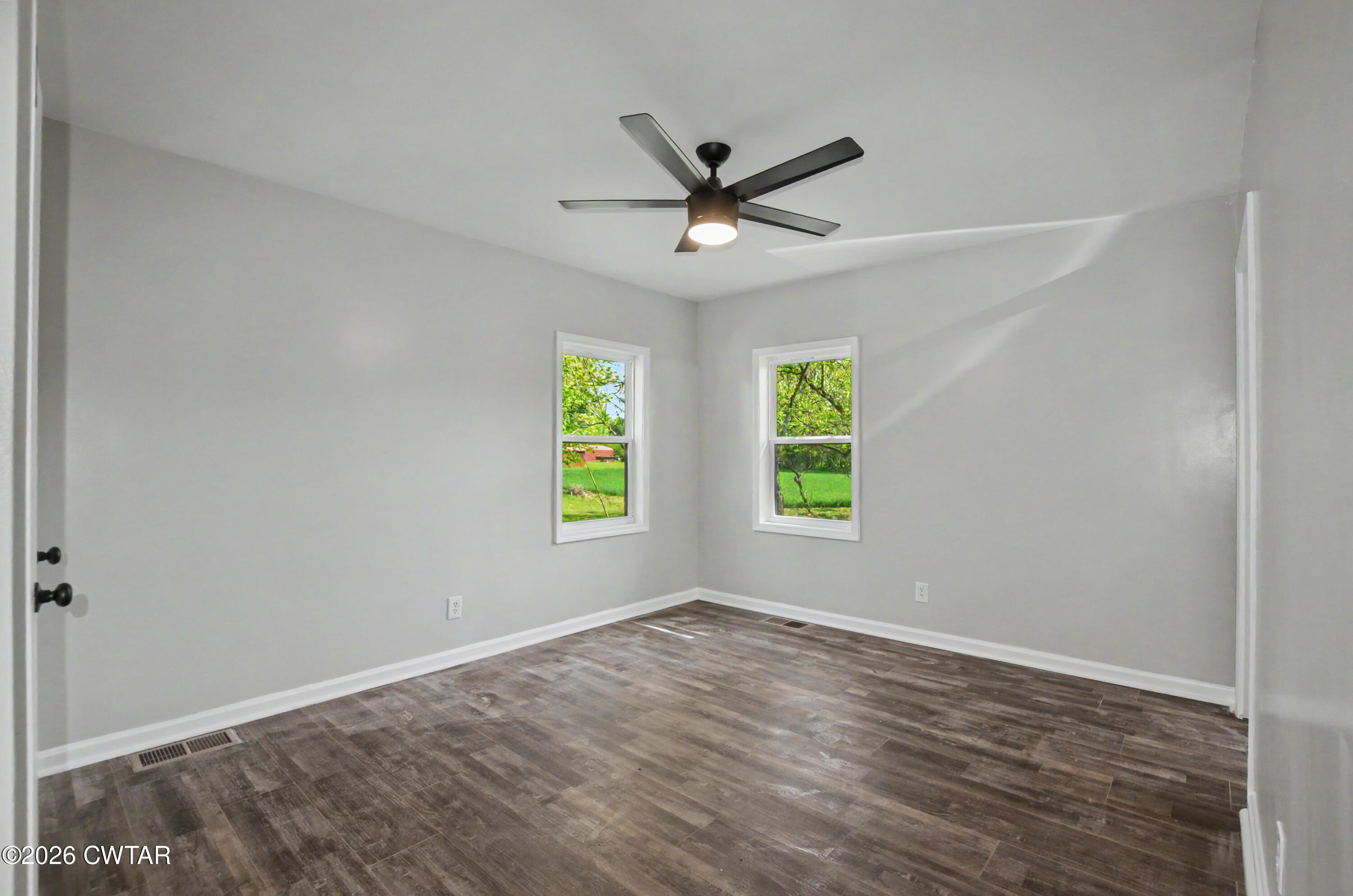 4177 Gum Flat Road Bells, TN 38006 - Photo 20 of 30 an empty room with window and ceiling fan
