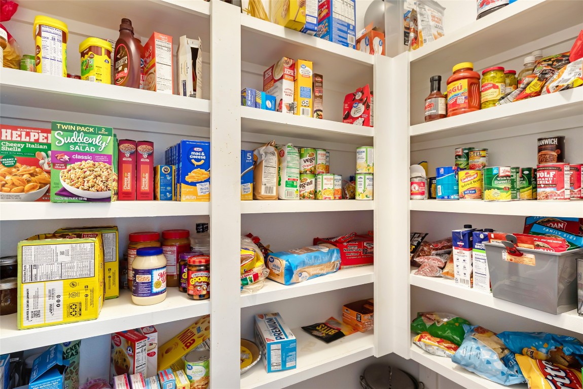 9910 Pine Forest Baytown, TX 77521 - Photo 13 of 26 a store room with lots of clutter and a refrigerator